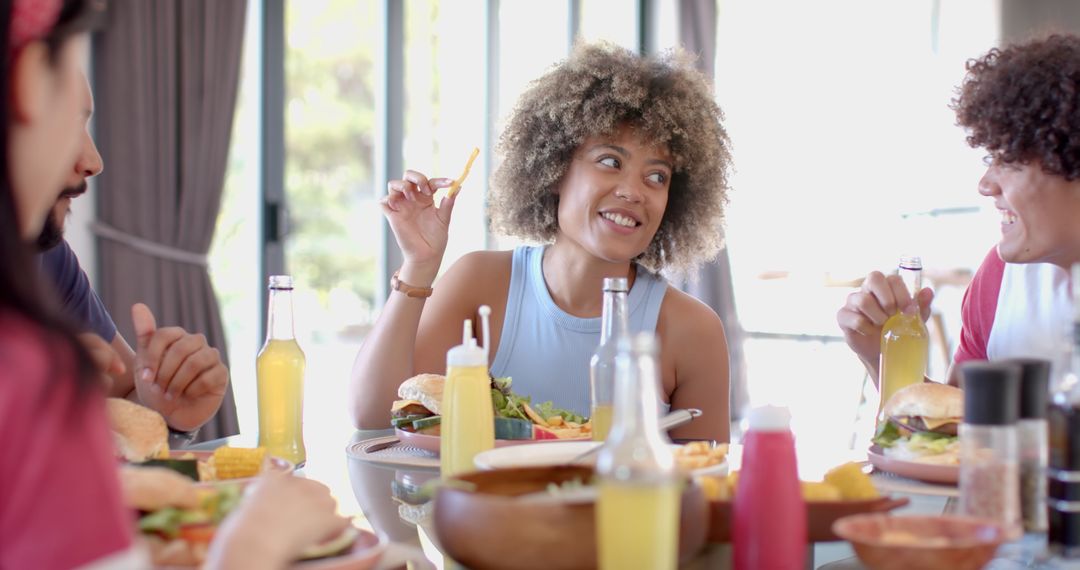Diverse Friends Sharing Fast Food Meal in Casual Setting