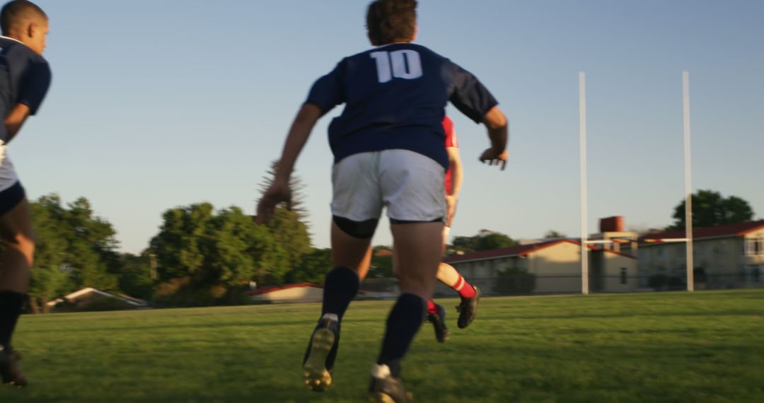 Rugby Players Running Towards Goal Post During Match - Free Images, Stock Photos and Pictures on Pikwizard.com