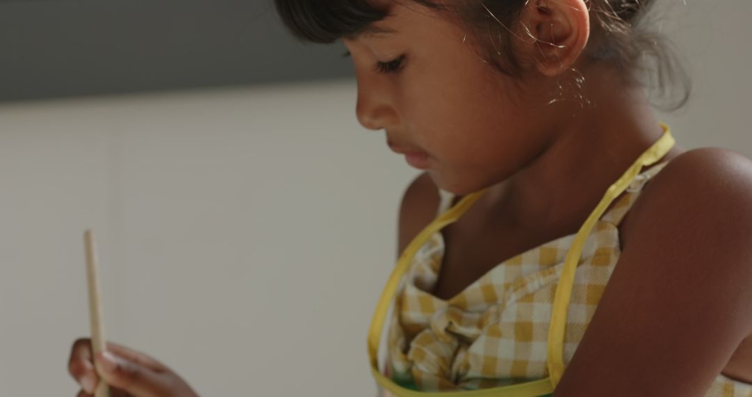 Child Focusing Quietly on Writing Task in Classroom Setting
