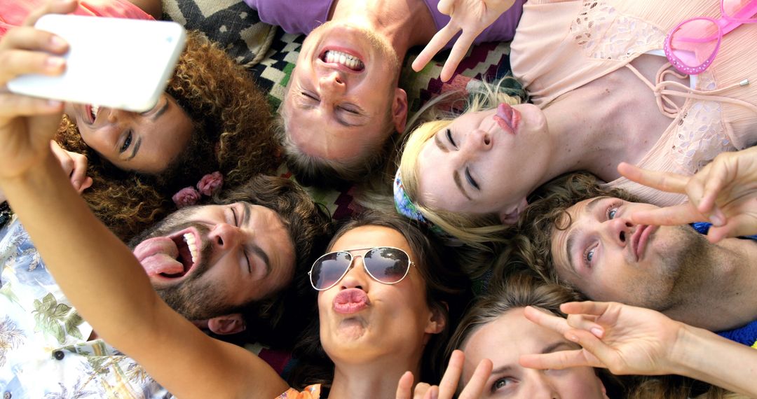 Group of Friends Lying in Grass Taking Selfie Together Sharing Fun Moments - Free Images, Stock Photos and Pictures on Pikwizard.com