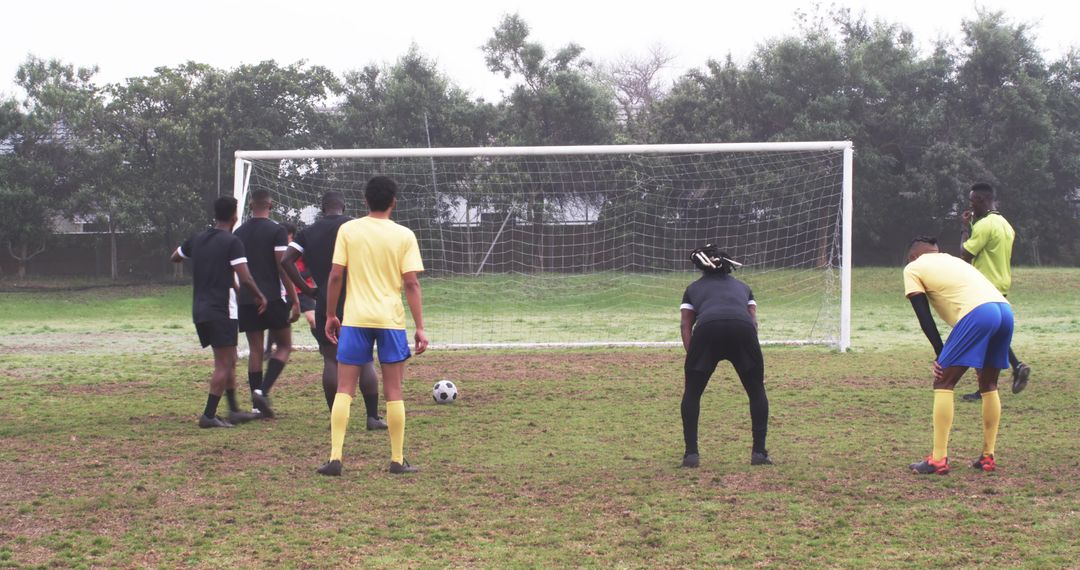 Diverse Soccer Players Preparing for Successful Free Kick