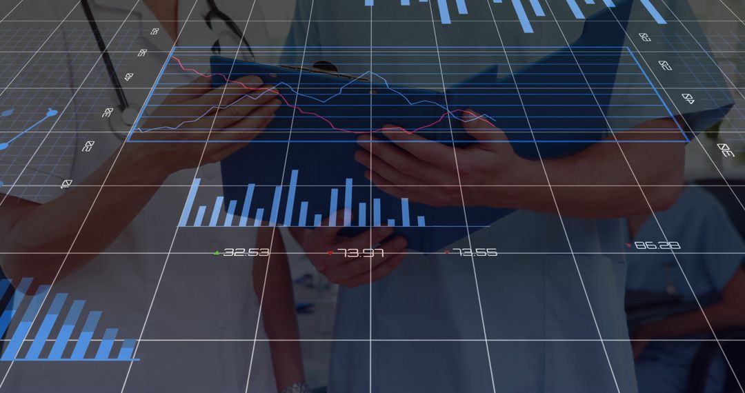 Healthcare Professionals Analyzing Digital Charts in Corridor