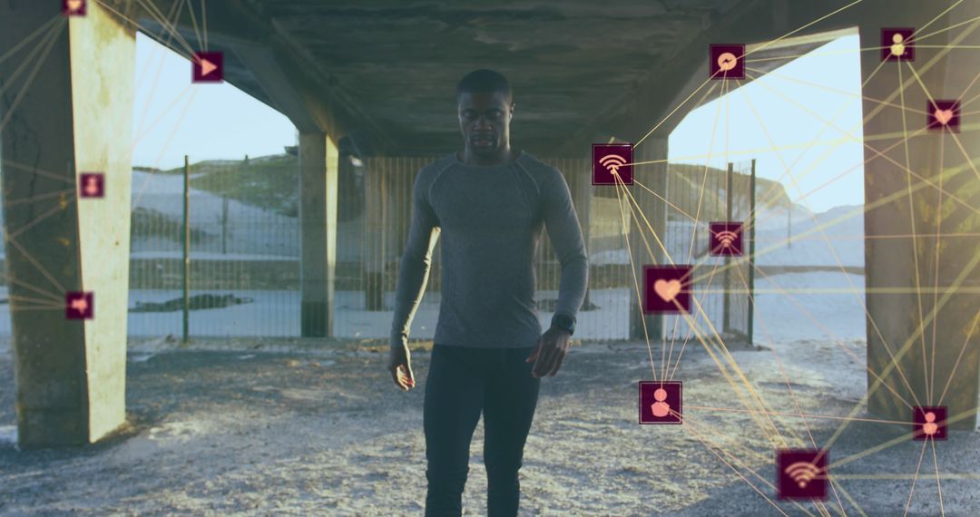 Fit Man with Digital Network of Spinning Icons Illustrating Technology Integration