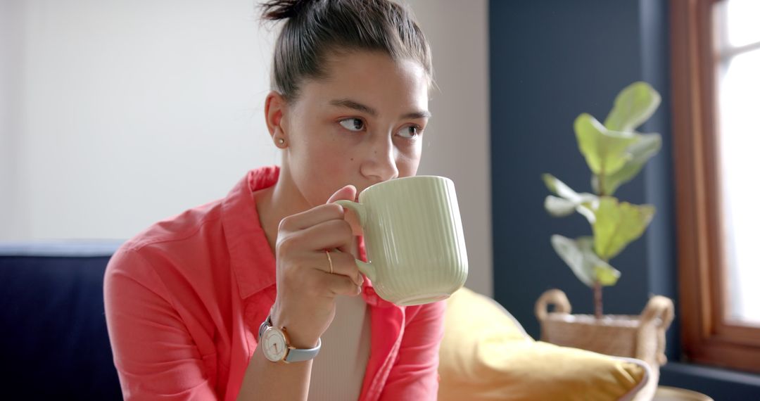 Thoughtful Woman Drinking Tea Relaxing at Home