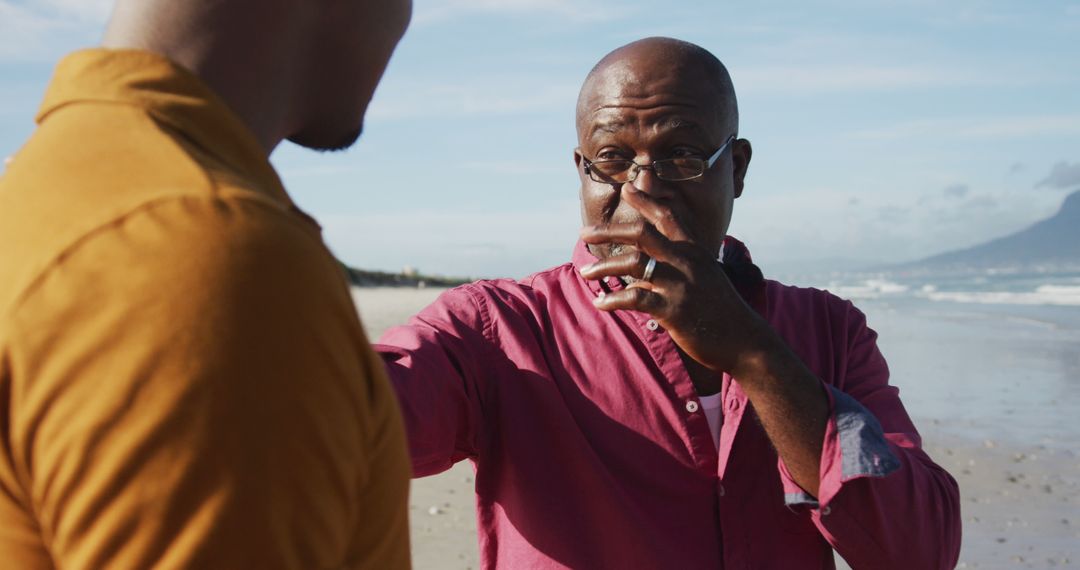 Elderly Man Playing Harmonica on Beach with Companion - Free Images, Stock Photos and Pictures on Pikwizard.com