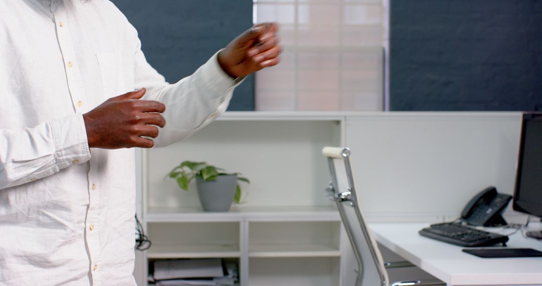 Business Professional Gesturing in Modern Office During Discussion