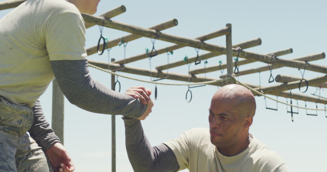 Supportive Military Training Comrades Overcoming Obstacles