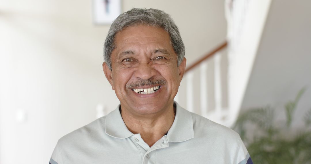 Smiling Elderly Man with Gray Hair and Mustache Indoors - Free Images, Stock Photos and Pictures on Pikwizard.com