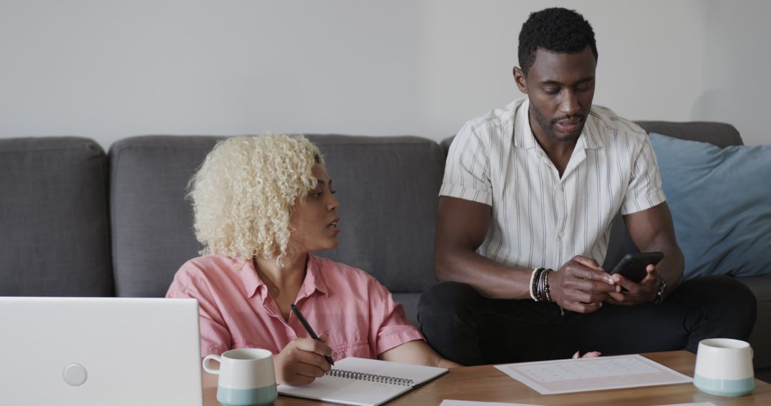 Friends Collaborating on Creative Project with Technology