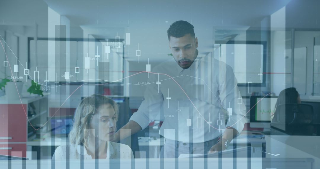 Diverse Professionals Analyzing Financial Graphs in Office