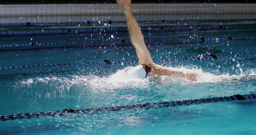 Competitive Swimmer Performing Backstroke Stroke in Swimming Pool - Free Images, Stock Photos and Pictures on Pikwizard.com