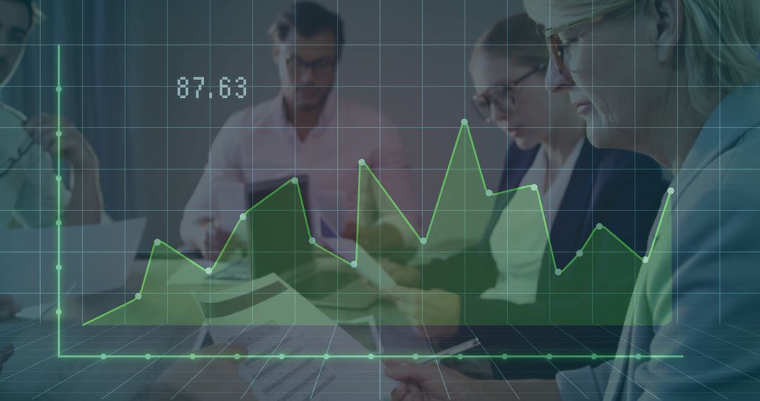 Financial Analysts Reviewing Graphs in Modern Office
