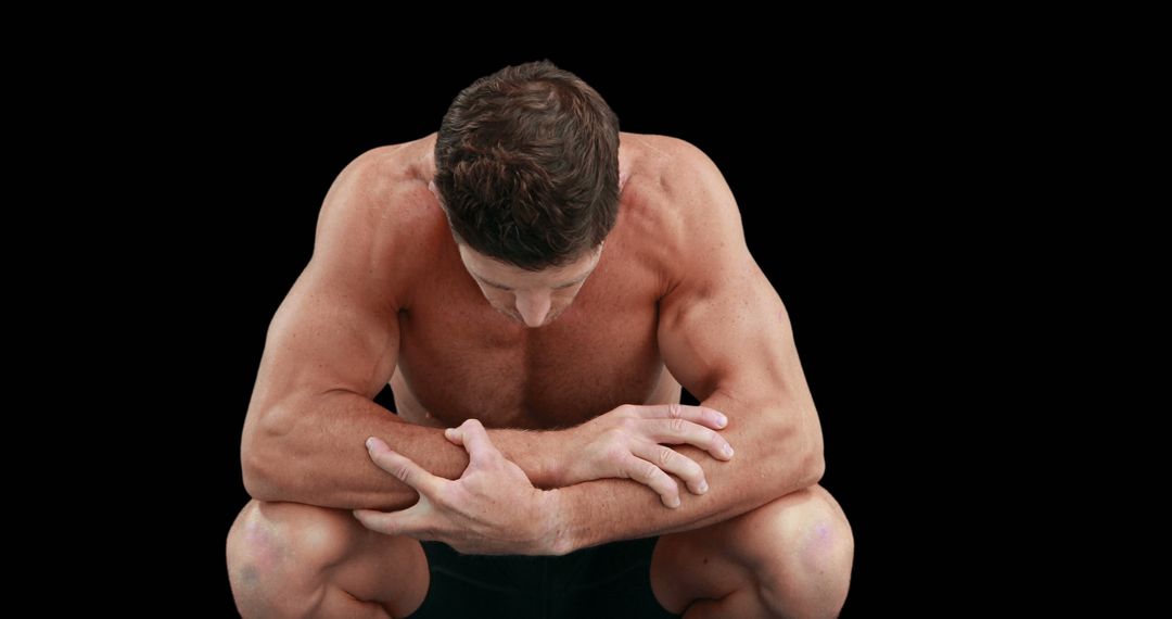 Fit Shirtless Man Resting in Squatting Position Against Black Background - Free Images, Stock Photos and Pictures on Pikwizard.com