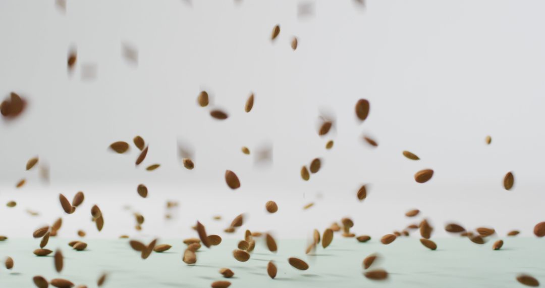 Falling Almonds on Clean Bright Background