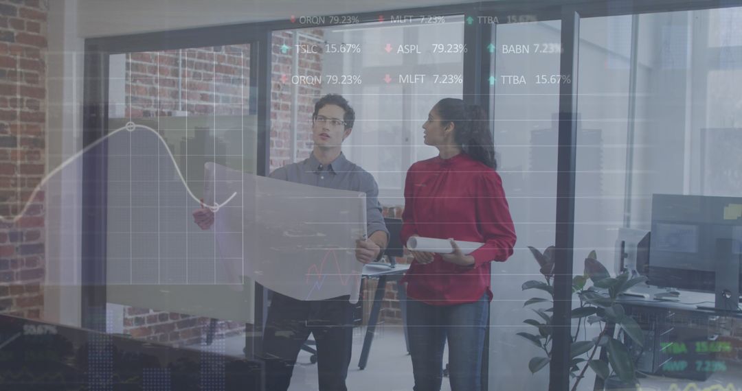 Diverse Business Team Analyzing Data and Blueprints in Office