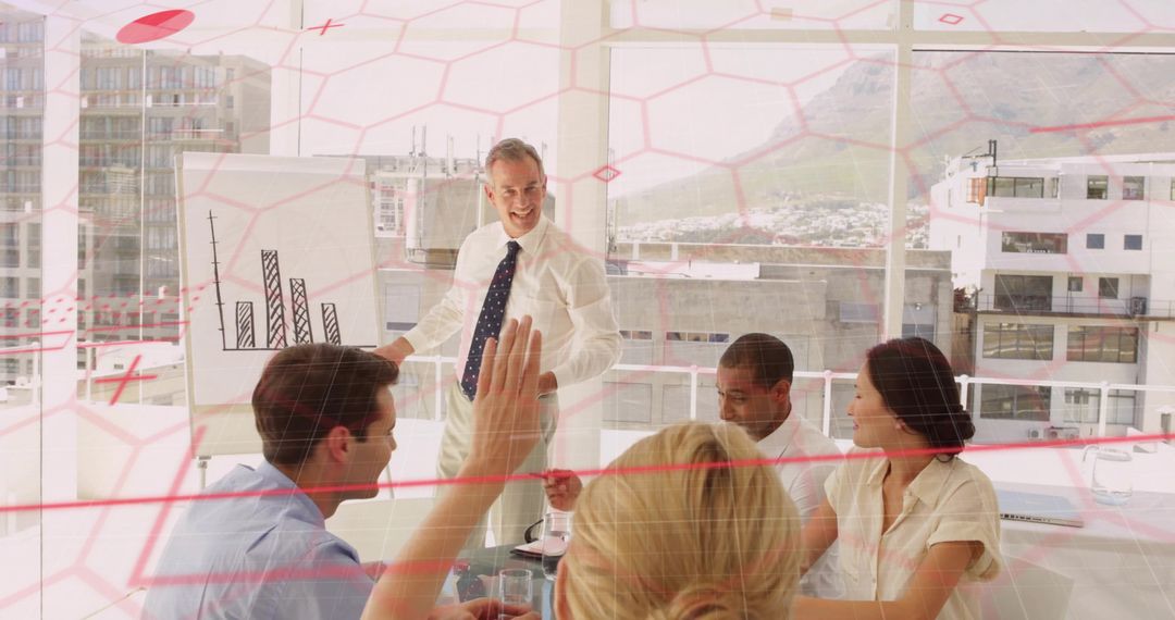Business leader presenting strategy in modern glass boardroom with team collaborating