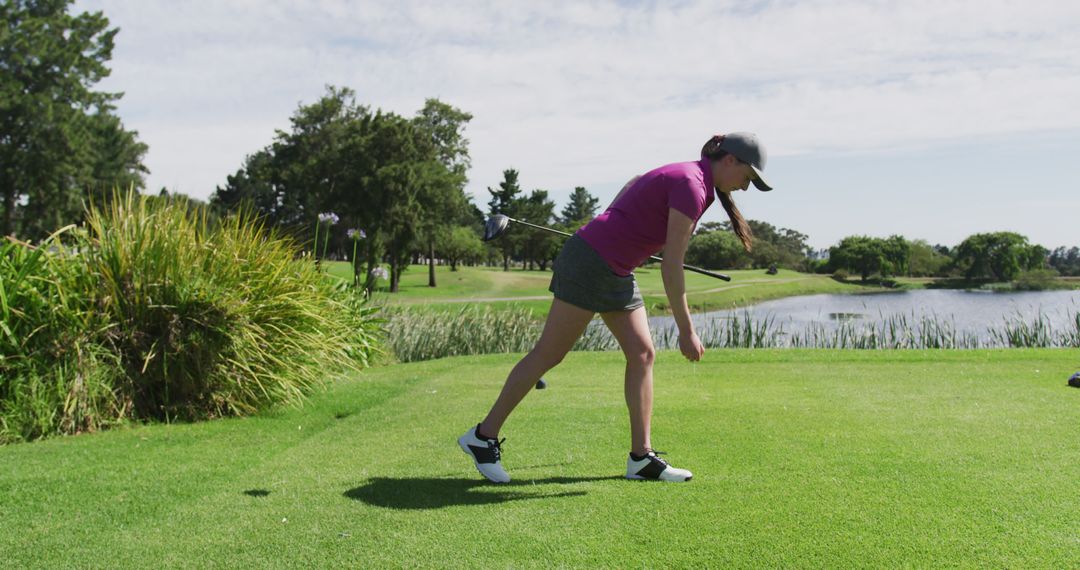 Female Athlete Playing Golf on Sunny Day - Free Images, Stock Photos and Pictures on Pikwizard.com