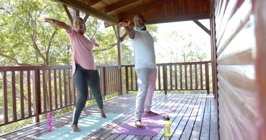 Senior Couple Practicing Yoga on Wooden Balcony in Nature - Free Images, Stock Photos and Pictures on Pikwizard.com