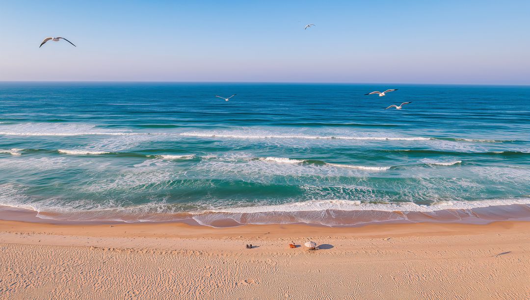 Two Adults Relaxing on Sunny Sandy Beach with Umbrella, Towels and Seagulls Over Sea