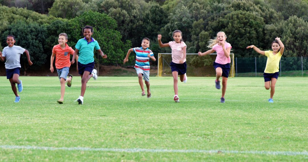 Diverse group of children running on grassy field - Free Images, Stock Photos and Pictures on Pikwizard.com