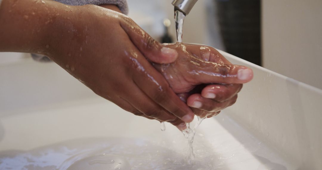 Person Washing Hands at Sink with Flowing Water - Free Images, Stock Photos and Pictures on Pikwizard.com