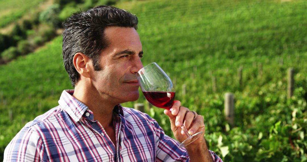 Man Savoring Glass of Red Wine at Vineyard - Free Images, Stock Photos and Pictures on Pikwizard.com