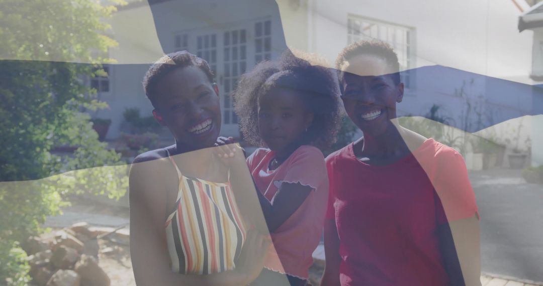 Smiling Mother and Daughters Posing Outside Suburban Home