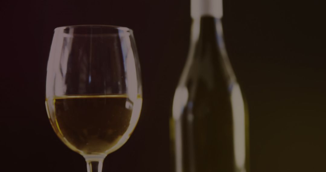 White Wine Close-Up with Elegant Bokeh Effect and Olives