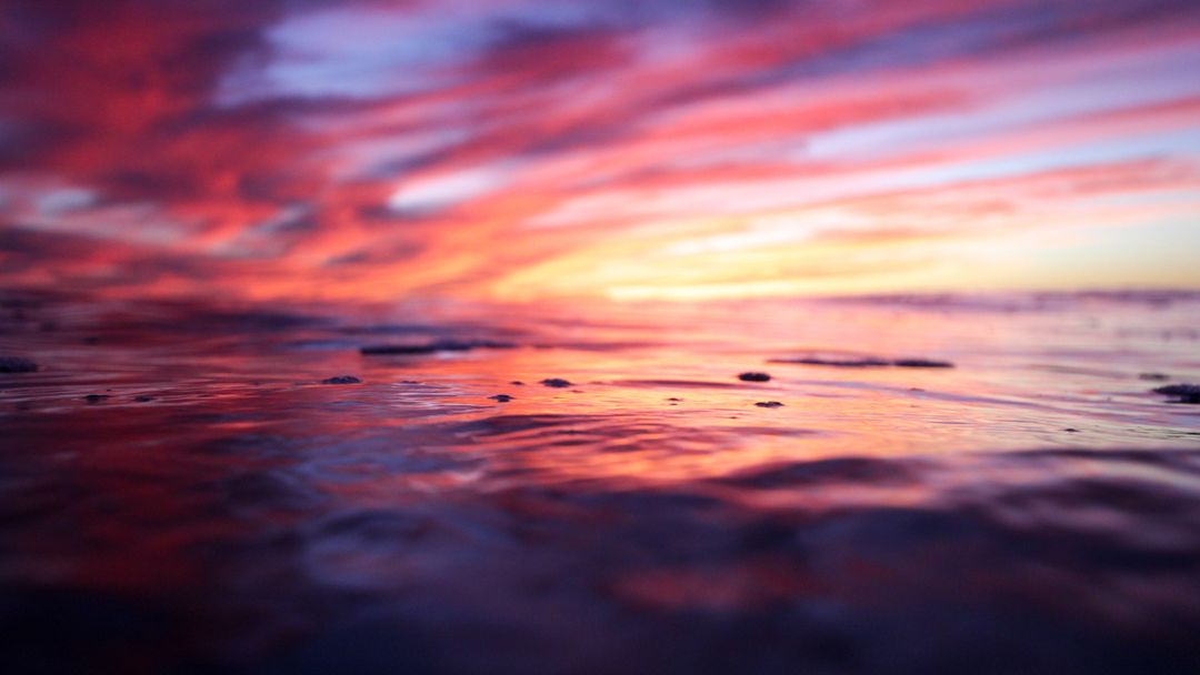 Stunning Sunset Reflection over Calm Ocean Waves - Free Images, Stock Photos and Pictures on Pikwizard.com
