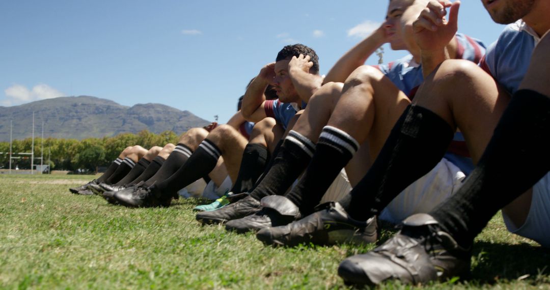 Soccer Team Resting Together After Training on Field - Free Images, Stock Photos and Pictures on Pikwizard.com