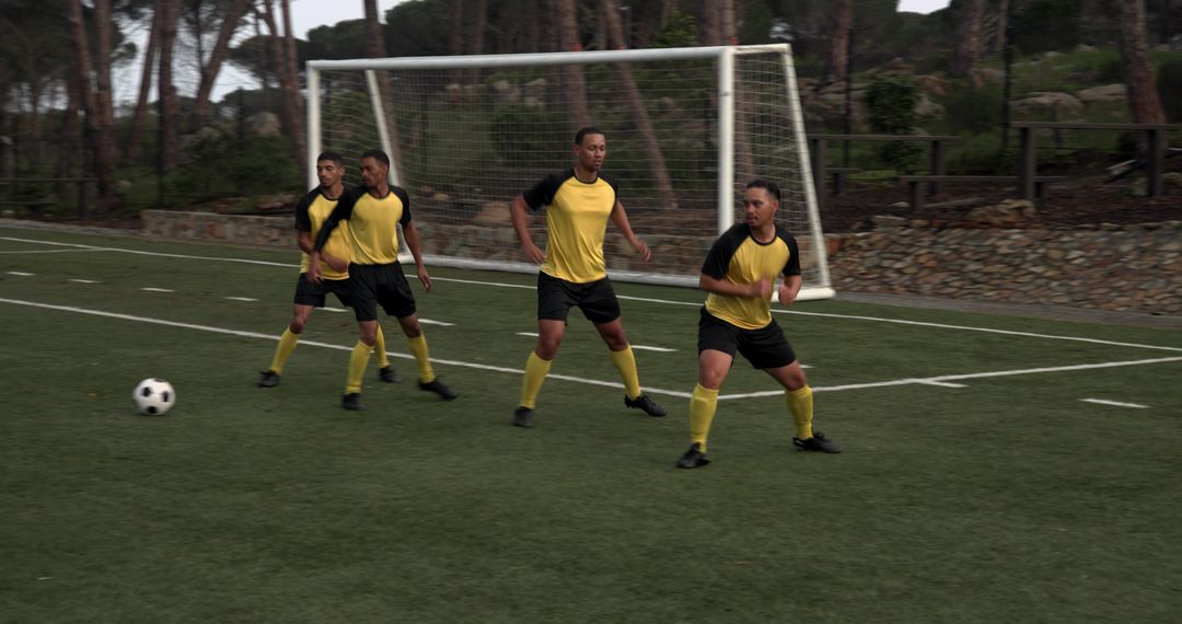 Soccer Players Competing for Ball on Field