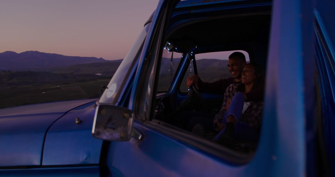 Couple Enjoying Sunset View from Vintage Pickup Truck - Free Images, Stock Photos and Pictures on Pikwizard.com