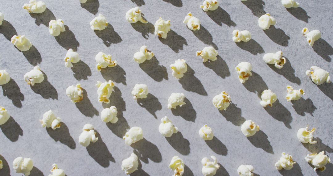 Pattern of Popcorn Kernels Casting Shadows on Gray Surface - Free Images, Stock Photos and Pictures on Pikwizard.com