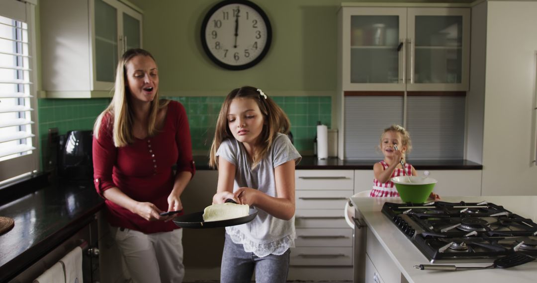 Mother and Daughters Cooking Breakfast in Modern Kitchen - Free Images, Stock Photos and Pictures on Pikwizard.com