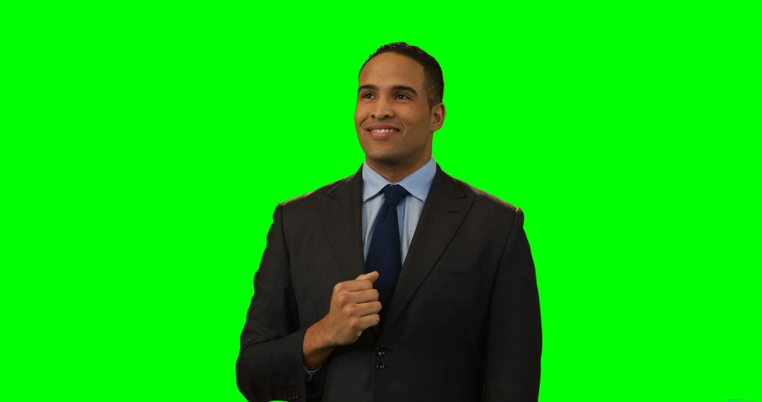 Confident Businessman in Dark Suit Smiling with Green Screen Background - Free Images, Stock Photos and Pictures on Pikwizard.com