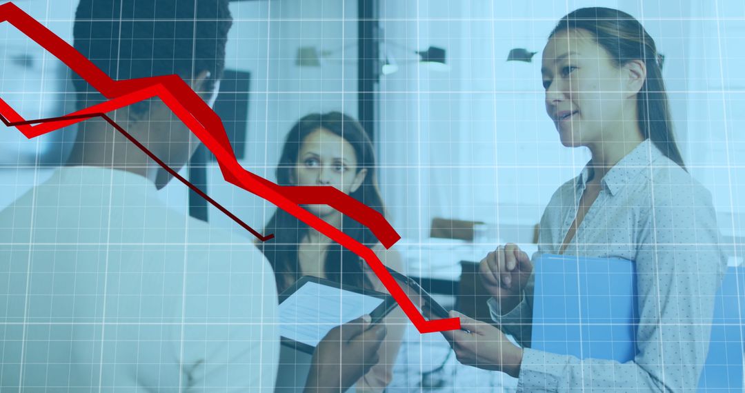 Diverse Business Team Reviewing Financial Decline Graph