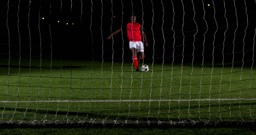 Soccer Player Preparing for Penalty Kick Under Night Lights - Free Images, Stock Photos and Pictures on Pikwizard.com