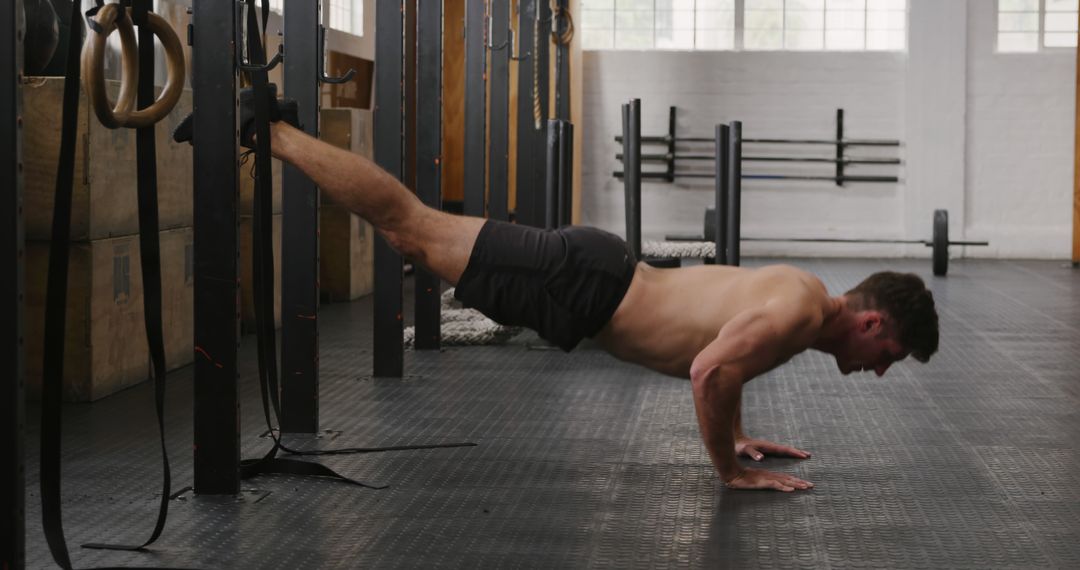 Man Doing Elevated Push-Ups in Gym for Strength Training - Free Images, Stock Photos and Pictures on Pikwizard.com