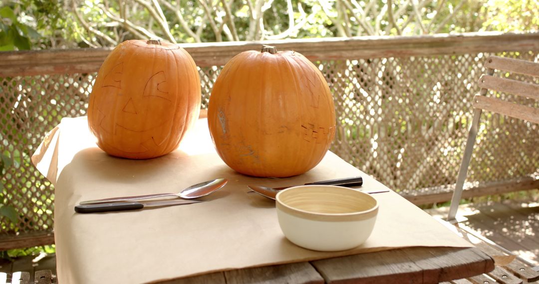 Pumpkin Carving Setup on Porch Preparing Halloween Decorations