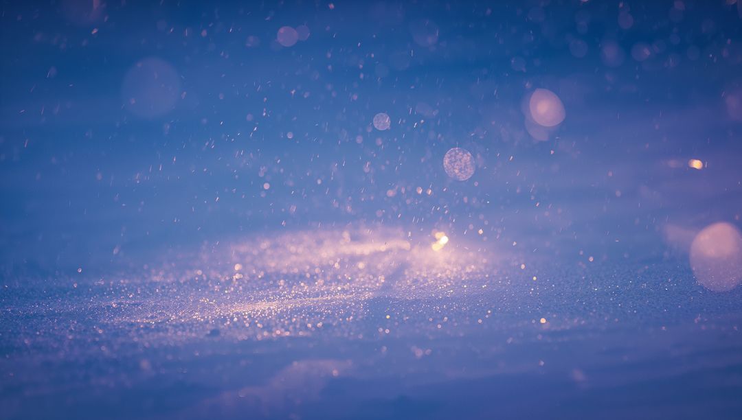 Shimmering Snow Crystals and Falling Flakes at Twilight with Bokeh Light Sparkle