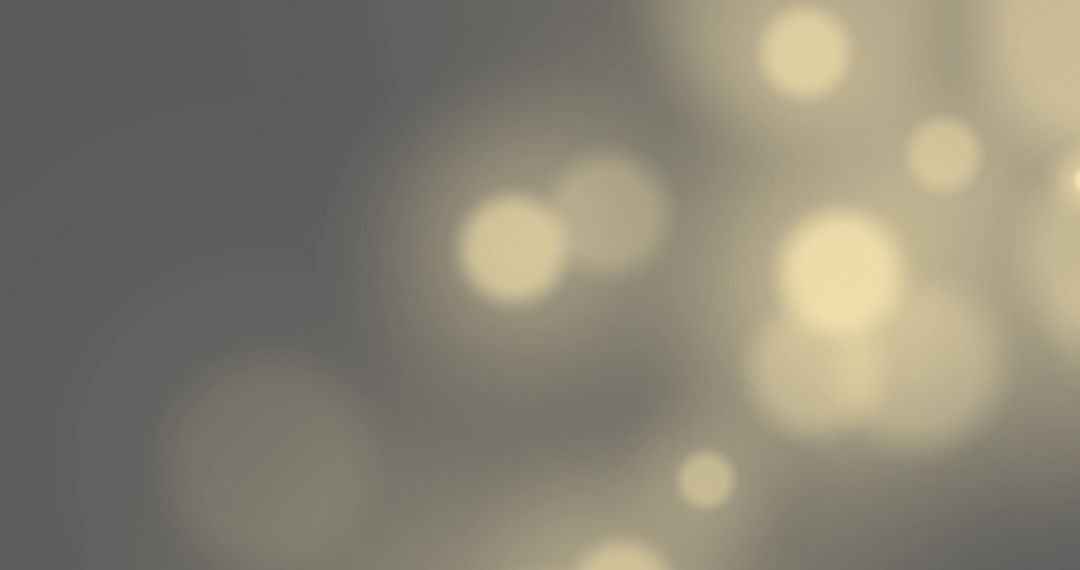 Abstract Golden Bokeh Lights on Grey Background