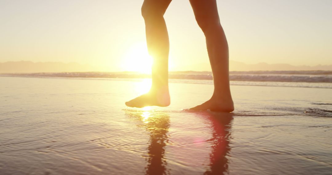 Silhouette of Legs Walking on Beach at Sunset - Free Images, Stock Photos and Pictures on Pikwizard.com