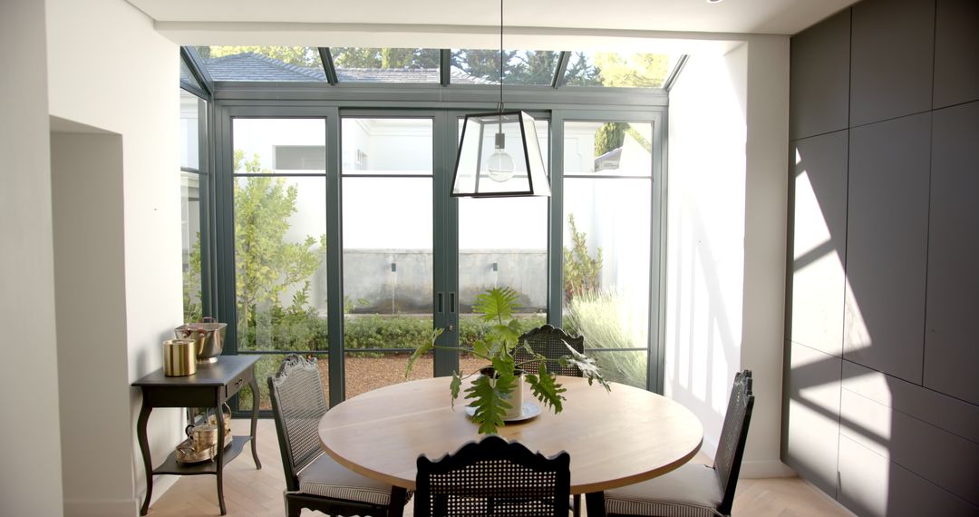 Bright Dining Room with Round Table and French Windows