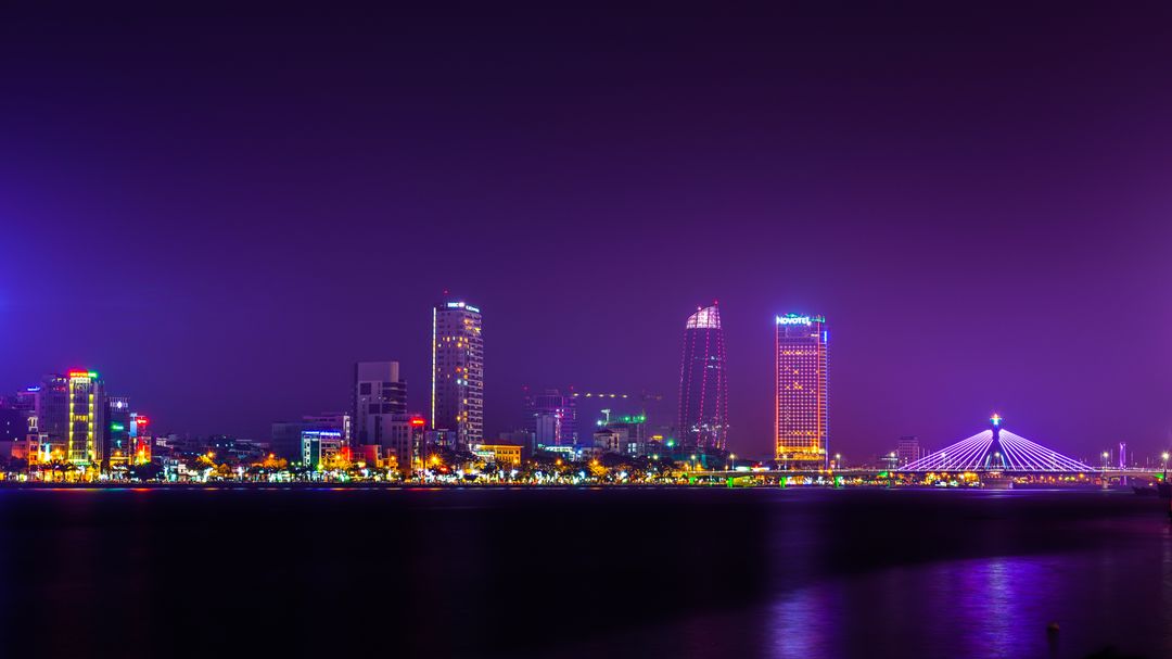 Colorful City Skyline Illuminated at Night - Free Images, Stock Photos and Pictures on Pikwizard.com