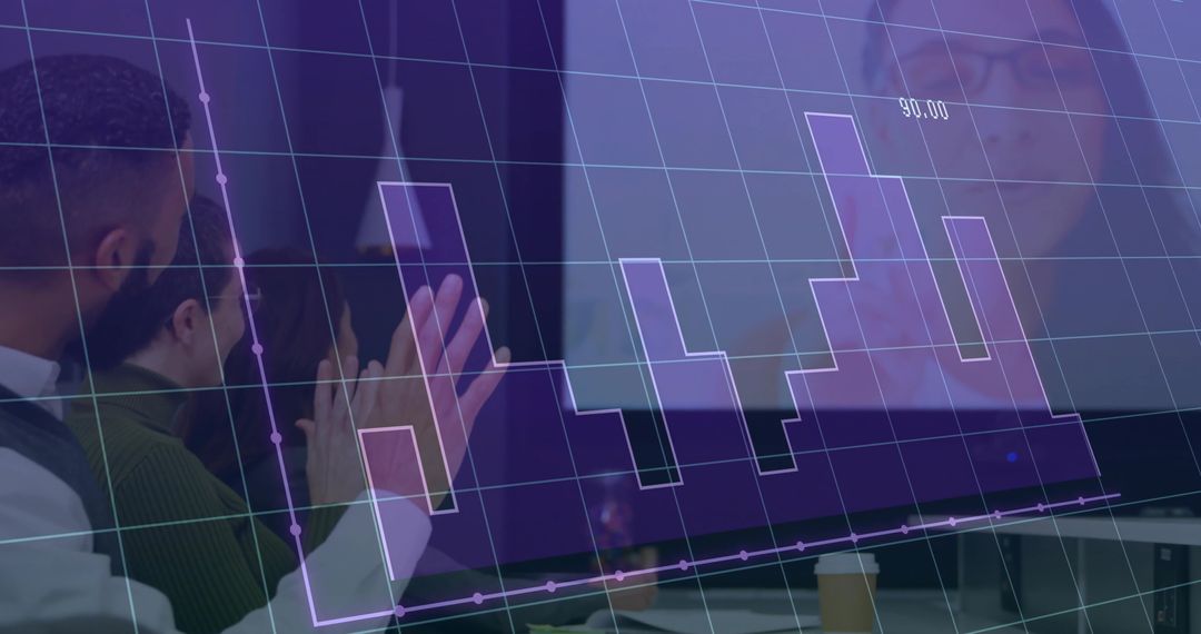 Business Team Analyzing Graph with Laptops in Modern Office