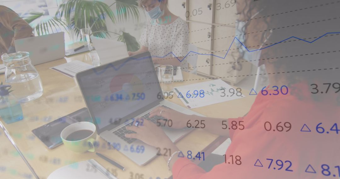 Business Team in Masks Analyzing Data with Digital Overlay