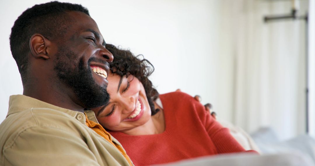 Couple Enjoying Quality Time Relaxing on Sofa at Home