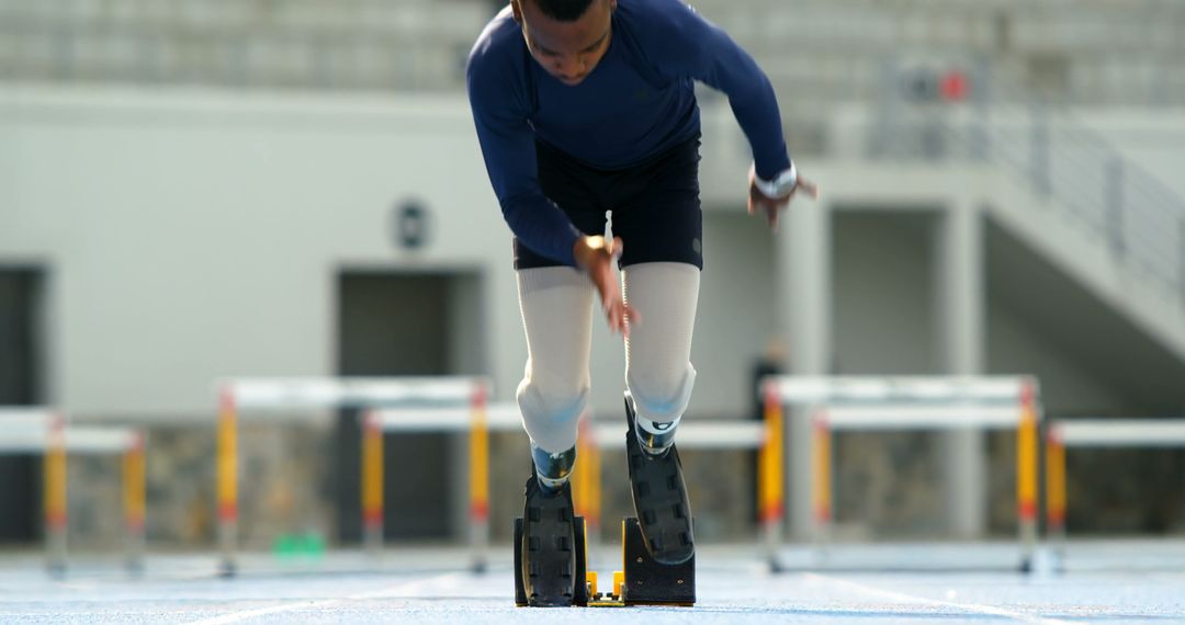 Paralympic athlete sprinting with running blades on track - Free Images, Stock Photos and Pictures on Pikwizard.com