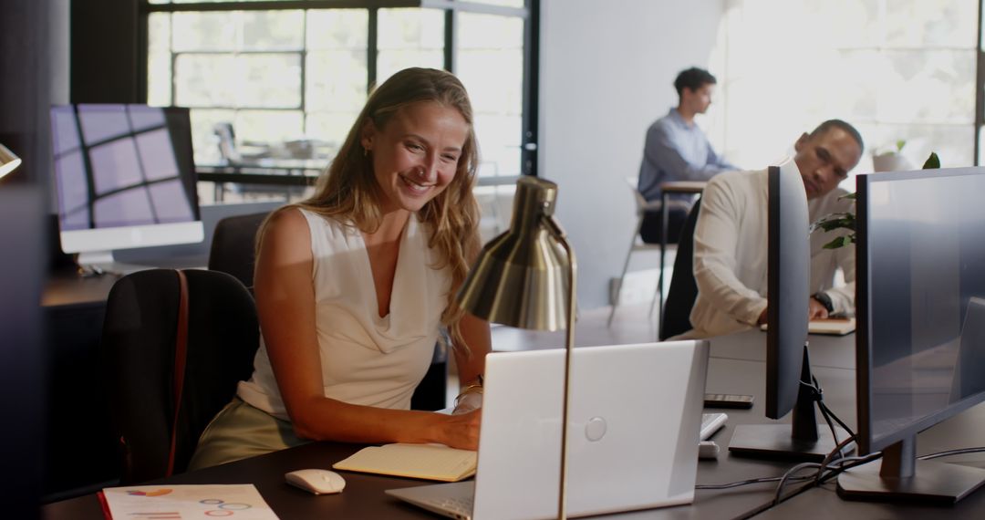 Diverse Professionals Strategizing in Modern Office Workspace