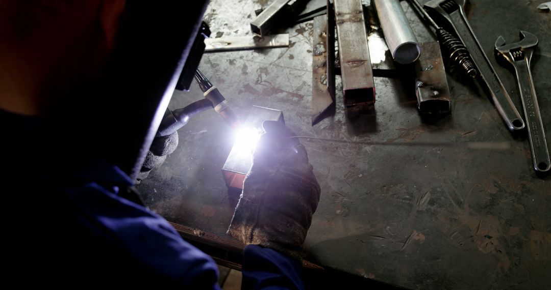 Welder Working with Blow Torch in Workshop - Free Images, Stock Photos and Pictures on Pikwizard.com